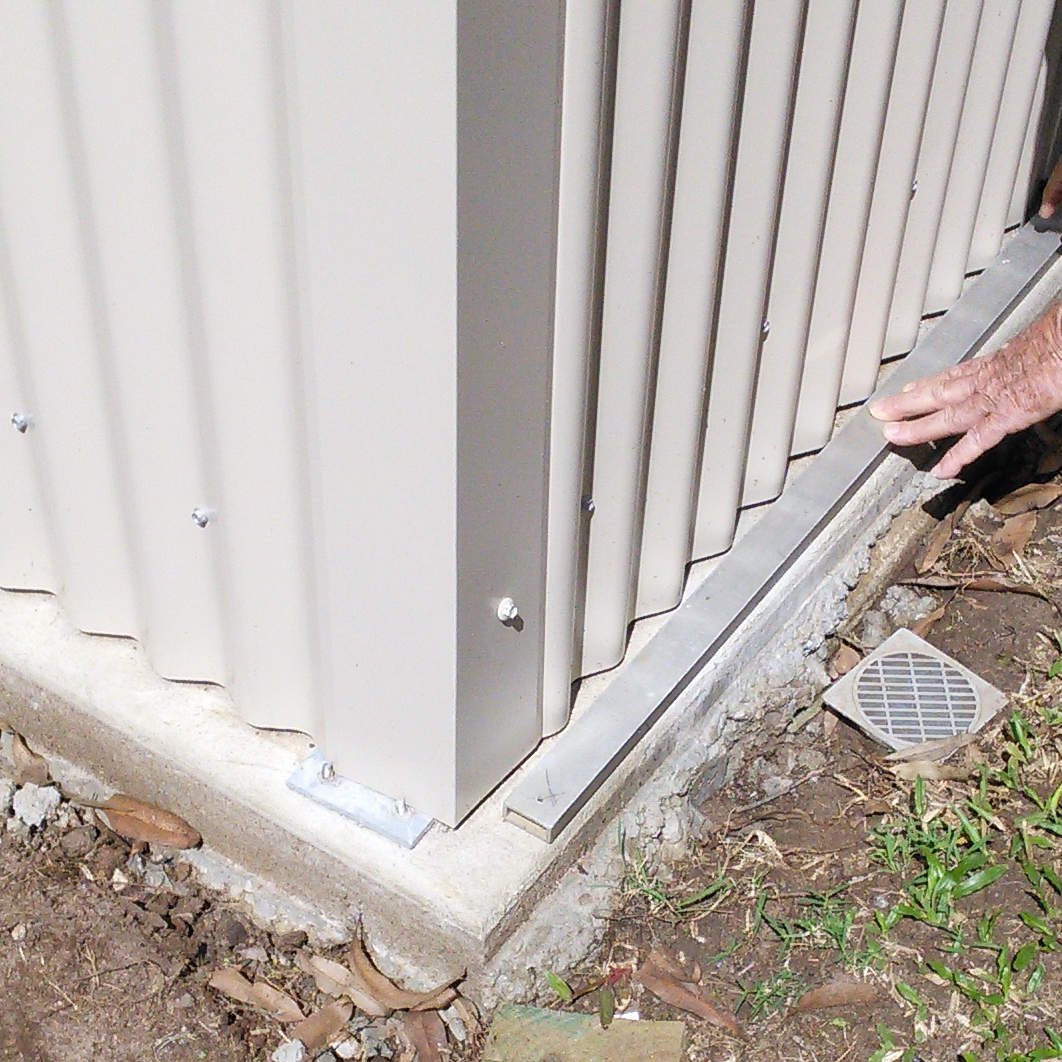 A Garden Shed with a gap between the concrete floor and wall